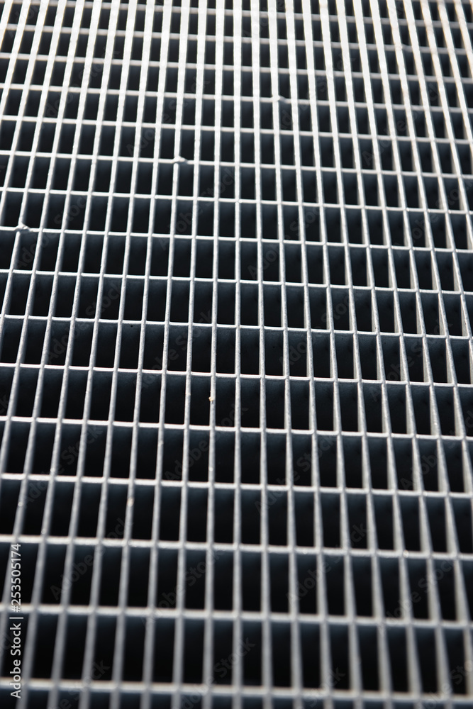 Metal lattice with small cells grid stock background with shallow  and selective focus