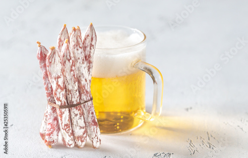 Snack fuet sausages with beer photo