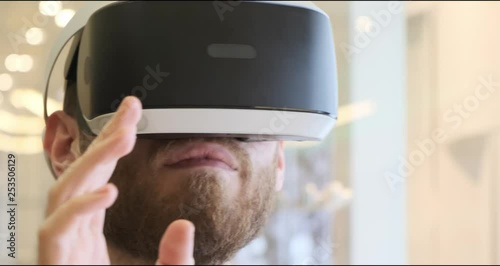 Man using virtual reality headset indoors 4k, close-up