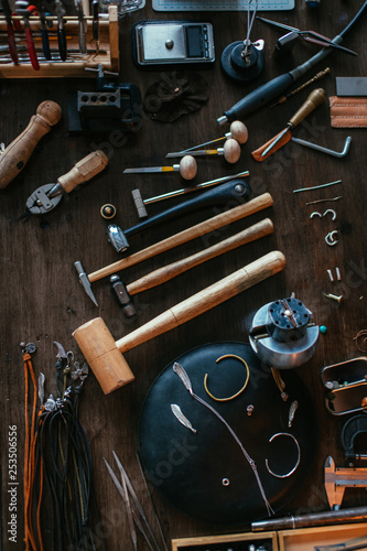 top view photo. of a jeweler artist's desk with many supplies