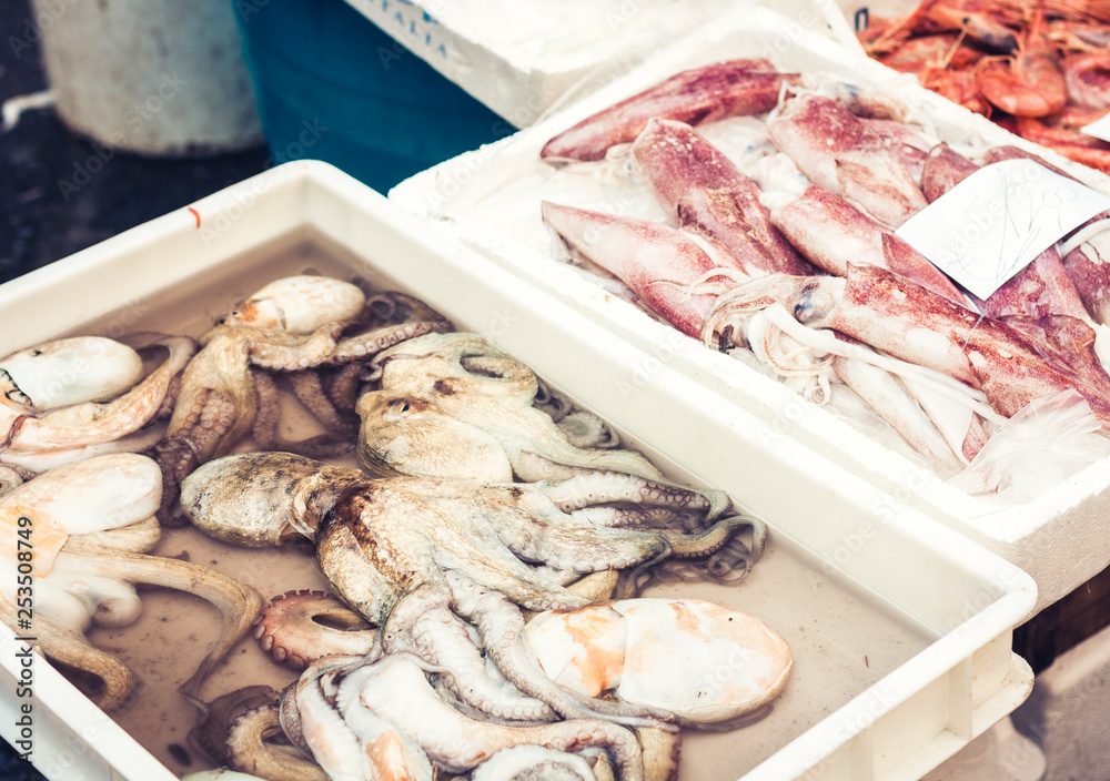 Fresh fish and seafood for sale in the fish market of Catania, Sicily, Italy. Fresh fish and seafood for sale in the fish market of Catania, Sicily, Italy.