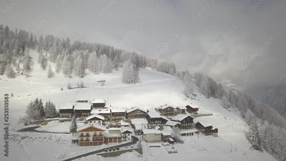 Aerial drone video flying on the top of the forest recently covered by fresh snow in Valle D’Aosta region at cold winter season. Aerial drone video flying on the top of the forest recently covered by fresh snow in Valle D’Aosta region at cold winter season.
