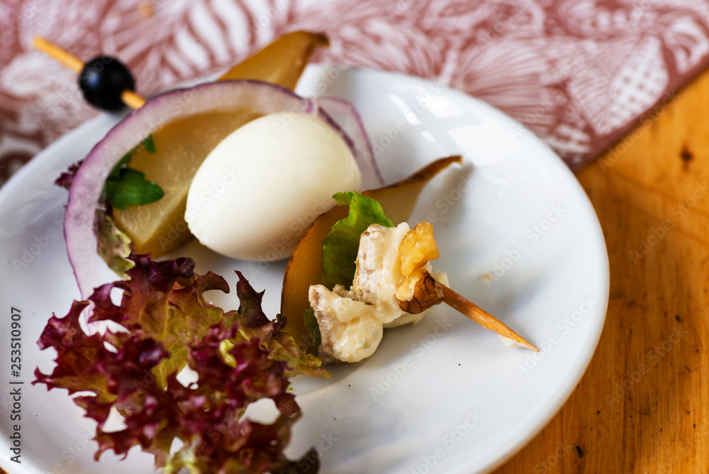 Small appetizer or breakfast with egg, lettuce, cheese and nut. Small appetizer or breakfast with egg, lettuce, cheese and nut.