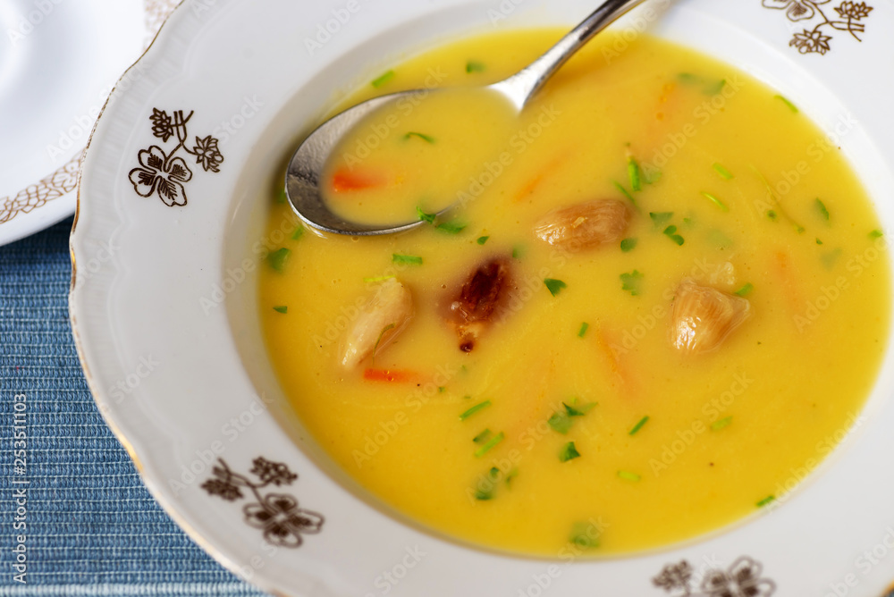 Vegetable soup with roasted garlic pieces. Vegetable soup with roasted garlic pieces.
