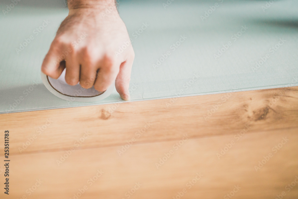 Laying laminate - bonding sheets of foam polystyrene with adhesive tape