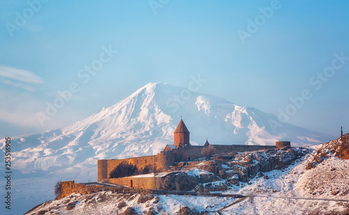 Ancient Armenian church Khor Virap with Ararat in winter sunrise photo