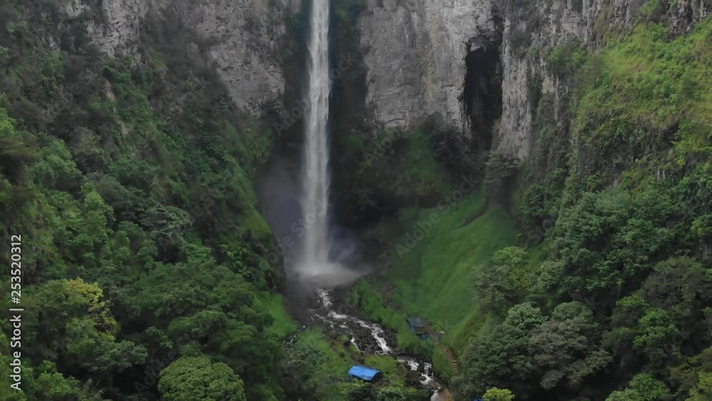 Aerial drone shot with a slow tilt reveal up of Sipiso Piso waterfall in Sumatra, Indonesia. Aerial drone shot with a slow tilt reveal up of Sipiso Piso waterfall in Sumatra, Indonesia.