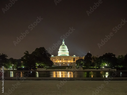 Washington DC, District of Columbia, Summer 2018 [United States US Capitol Building, night view with lights over reflecting pond, park fountain]