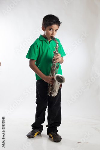 Indian Boy Child Playing Saxophone