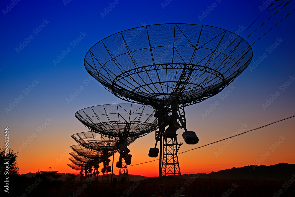 The silhouette of a radio telescope observatory The silhouette of a radio telescope observatory