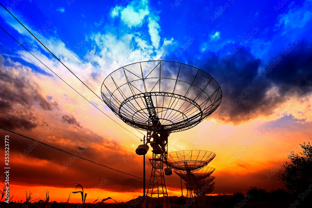 The silhouette of a radio telescope observatory The silhouette of a radio telescope observatory