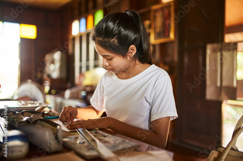 thai teen girl doing homework and studying at home