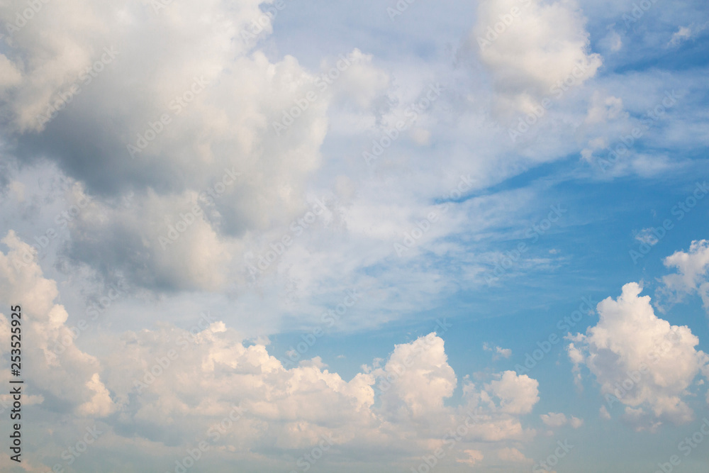 White fluffy clouds against a blue sky.