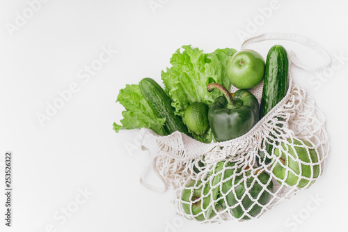 white mesh bag vegetables fruits isolated