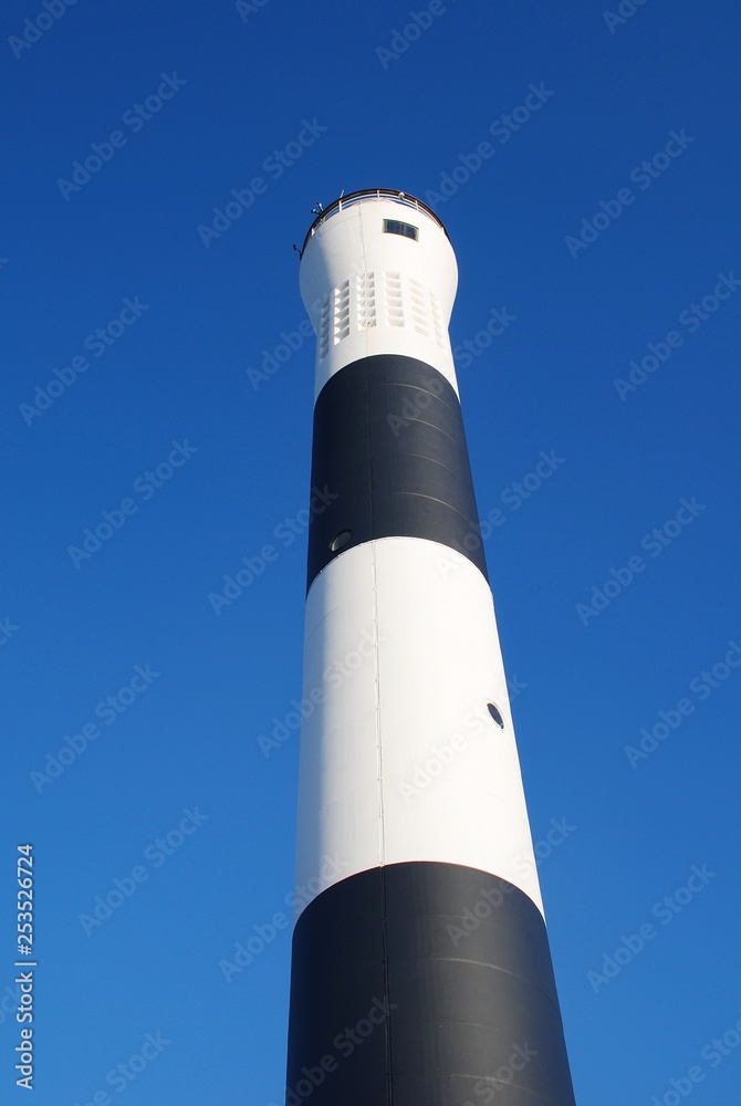 The new automatic lighthouse at Dungeness in Kent, England. It replaced the old manned lighthouse in 1961. The new automatic lighthouse at Dungeness in Kent, England. It replaced the old manned lighthouse in 1961.