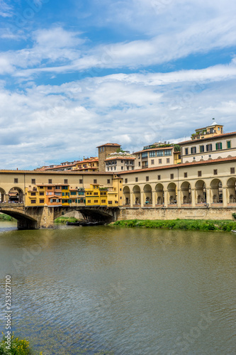 Italy,Florence, Arno, a large bridge over some water with Arno in the background