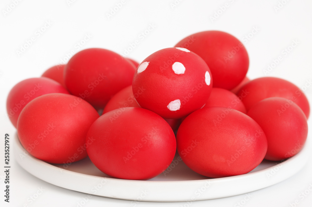 Red Easter eggs in plate Red Easter eggs in plate