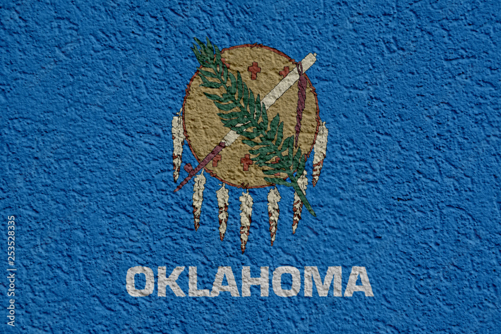 Obraz premium US State Politics Or Business Concept: Oklahoma Flag Wall With Plaster, Background Texture