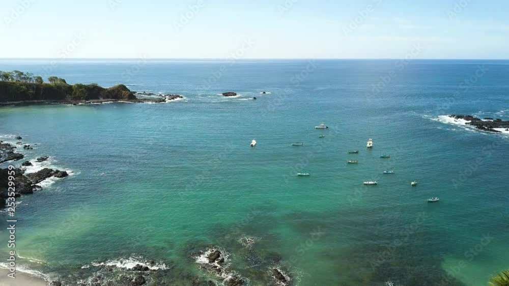 Boats floating in a beautiful tropical bay. Boats floating in a beautiful tropical bay.