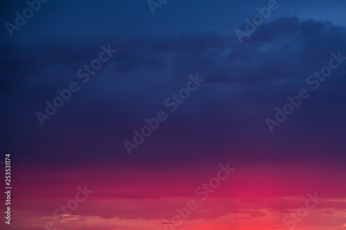 abstract sunset sky background with bright pink stripe at the bottom
