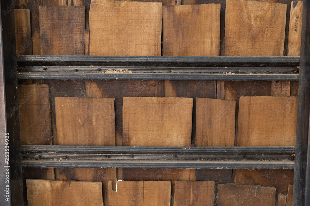 pieces of wooden plank wall with black steel shelves. pieces of wooden plank wall with black steel shelves.