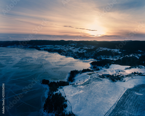 sunset over frozen sea