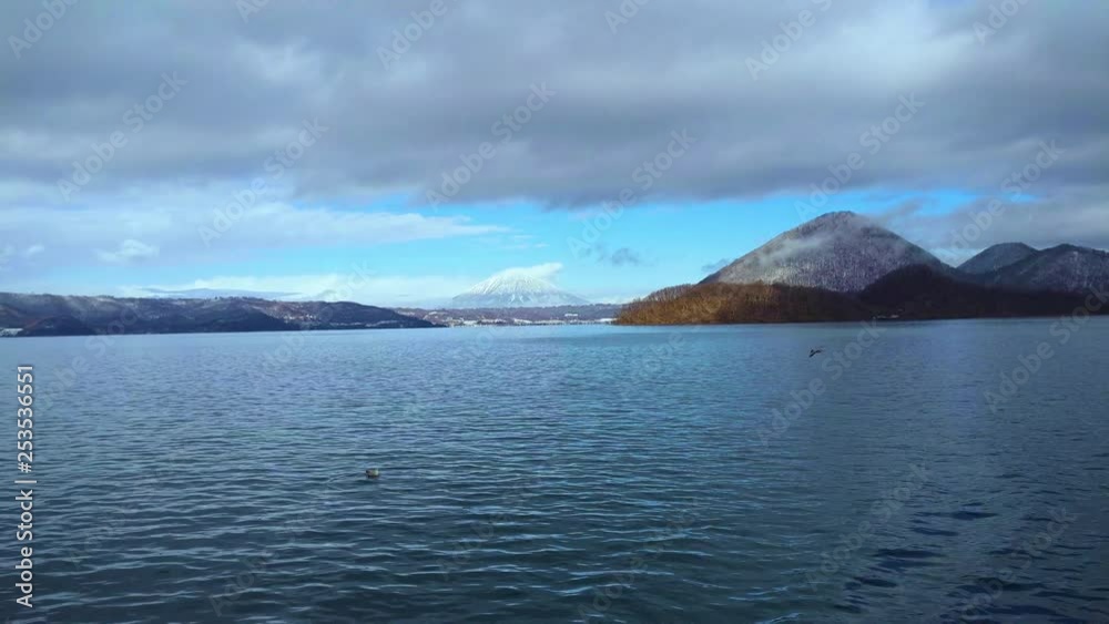 Panning view of Mount Yotei from Lake Toya, taken from a moving cruise Panning view of Mount Yotei from Lake Toya, taken from a moving cruise