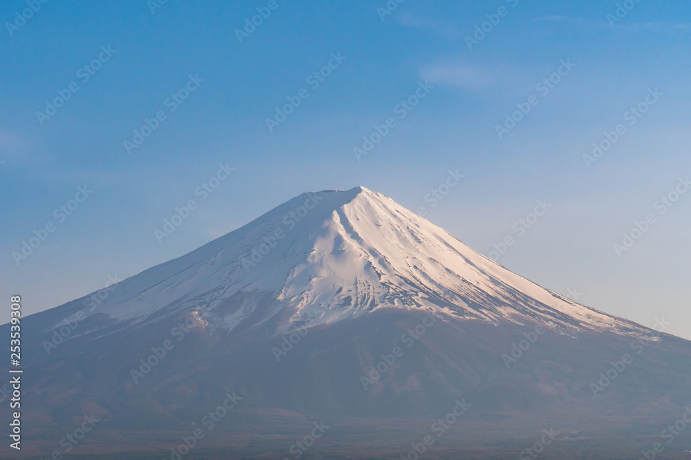 Snow covered Mt. Fuji with blue sky in spring season.