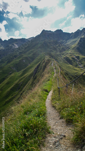 narrow path alongside hilltop step cliff