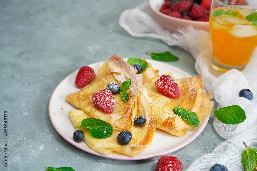 Homemade Crepes with fresh fruits and berries, selective focus Homemade Crepes with fresh fruits and berries, selective focus