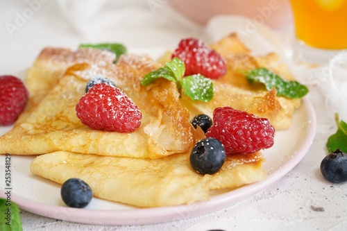 Homemade Crepes with fresh fruits and berries, selective focus