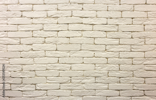 Close-up of white painted whitewashed solid brick wall. Abstract copy space background  Bricklaying  construction and masonry concept.