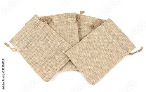 Burlap gift bags on isolated white background