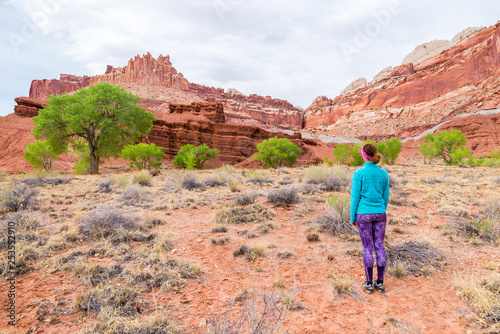 Young woman is looking at the Castle in Capitol Reef National Park, Utah, United states of America.