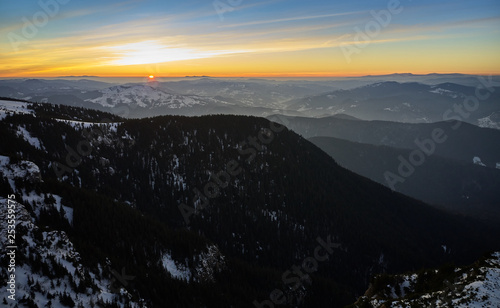 Aerial Landscape view from Ceahlău Mountains National Park at sunrise in winter season © DannyIacob