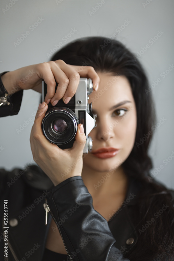 Beautiful young woman with camera Beautiful young woman with camera