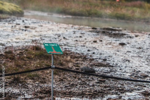 Warning sign near about height temperature water, near Geysir photo