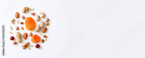 Assorted nuts on a white table. Hazelnuts  cashews  peanuts  walnuts  almonds.