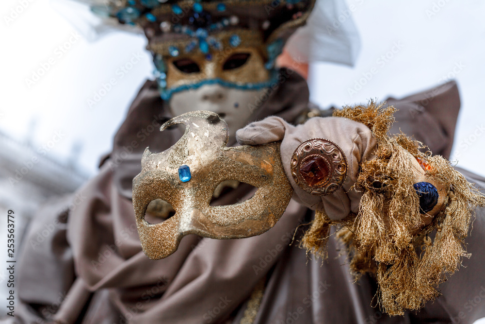 Close-up of a costume reveller poses during the Carnival in Venice, Italy