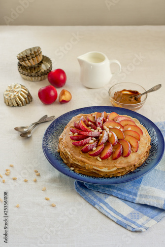 Pancake pie with caramel cream and fruit