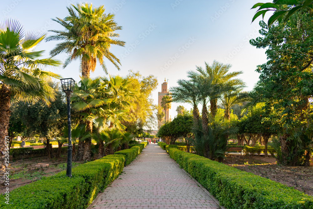 Walkway at Parc Lalla Hasna in Marrakech Morocco with Koutoubia Mosque in the background