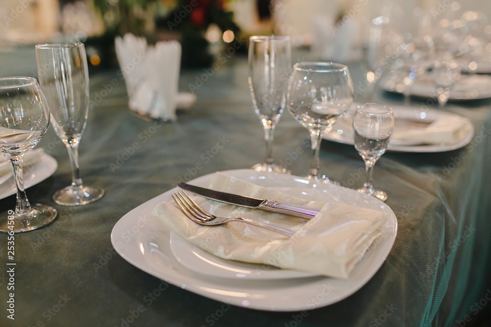Crystal dishes on a restaurant table, open background. Crystal dishes on a restaurant table, open background.