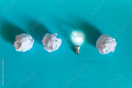 Concept of bright idea with paper and light bulbs