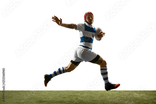 The silhouette of one caucasian rugby man player isolated on white background. Studio shot of fit man in motion or movement with ball. Jump and action concept. an incredible strain of all forces © master1305
