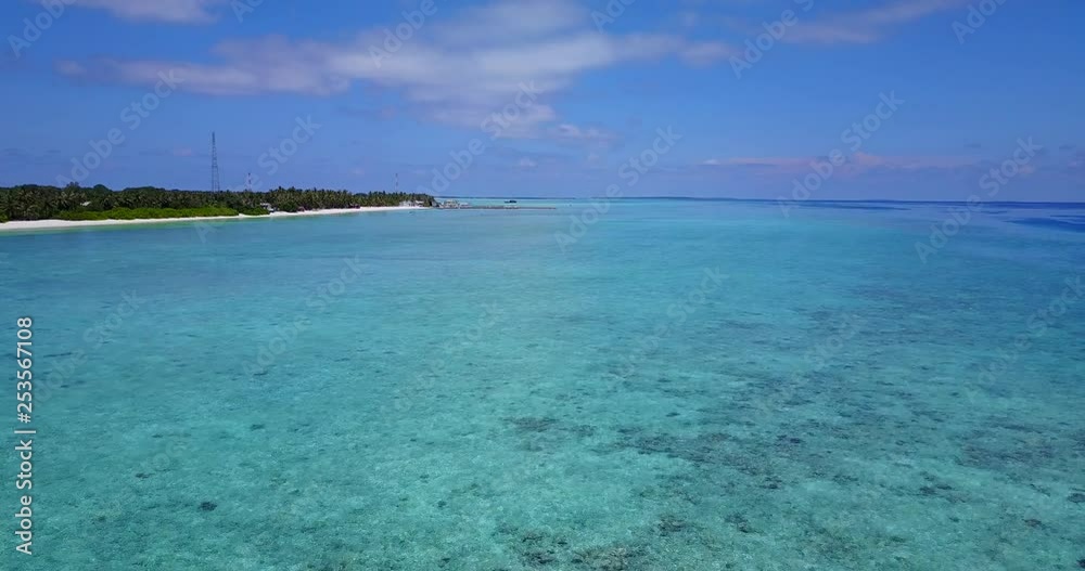 Rise over Maldives shallow blue sea with tropical island in distance, 4k Rise over Maldives shallow blue sea with tropical island in distance, 4k