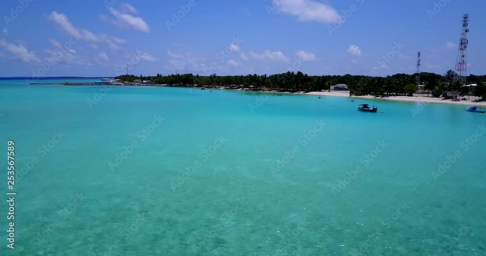 fast flight towards an island covered with palm trees over the turquoise waters of the Caribbean sea fast flight towards an island covered with palm trees over the turquoise waters of the Caribbean sea