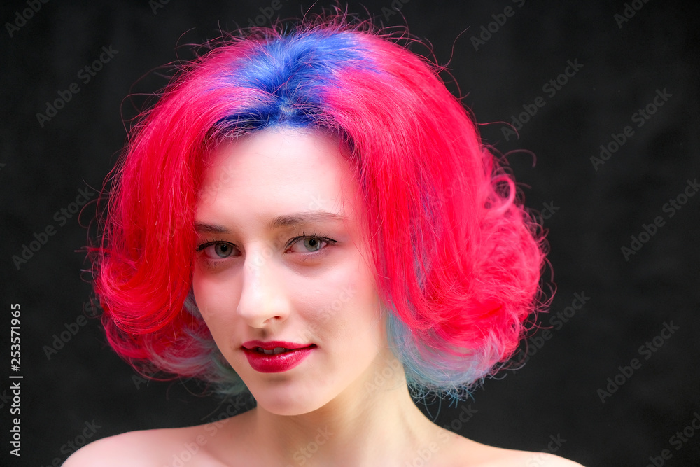 High fashion model woman with multi-colored hair posing in studio, portrait of beautiful sexy girl with a fashionable makeup and manicure. High fashion model woman with multi-colored hair posing in studio, portrait of beautiful sexy girl with a fashionable makeup and manicure.