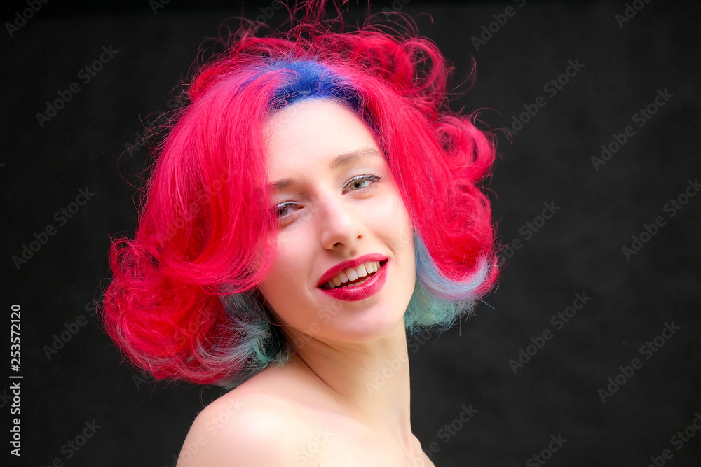 High fashion model woman with multi-colored hair posing in studio, portrait of beautiful sexy girl with a fashionable makeup and manicure. High fashion model woman with multi-colored hair posing in studio, portrait of beautiful sexy girl with a fashionable makeup and manicure.