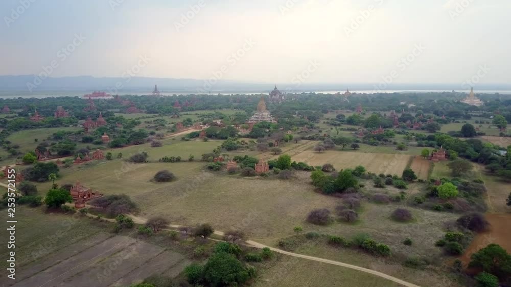 aerial 4k overfly of fields and temples in the Bagan temple area of Myanmar. aerial 4k overfly of fields and temples in the Bagan temple area of Myanmar.