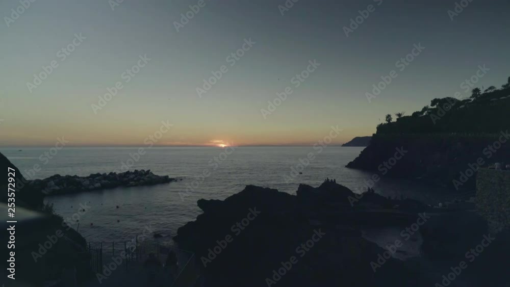 Timelapse of the evening sun setting over the Ligurian Sea in Italy Timelapse of the evening sun setting over the Ligurian Sea in Italy